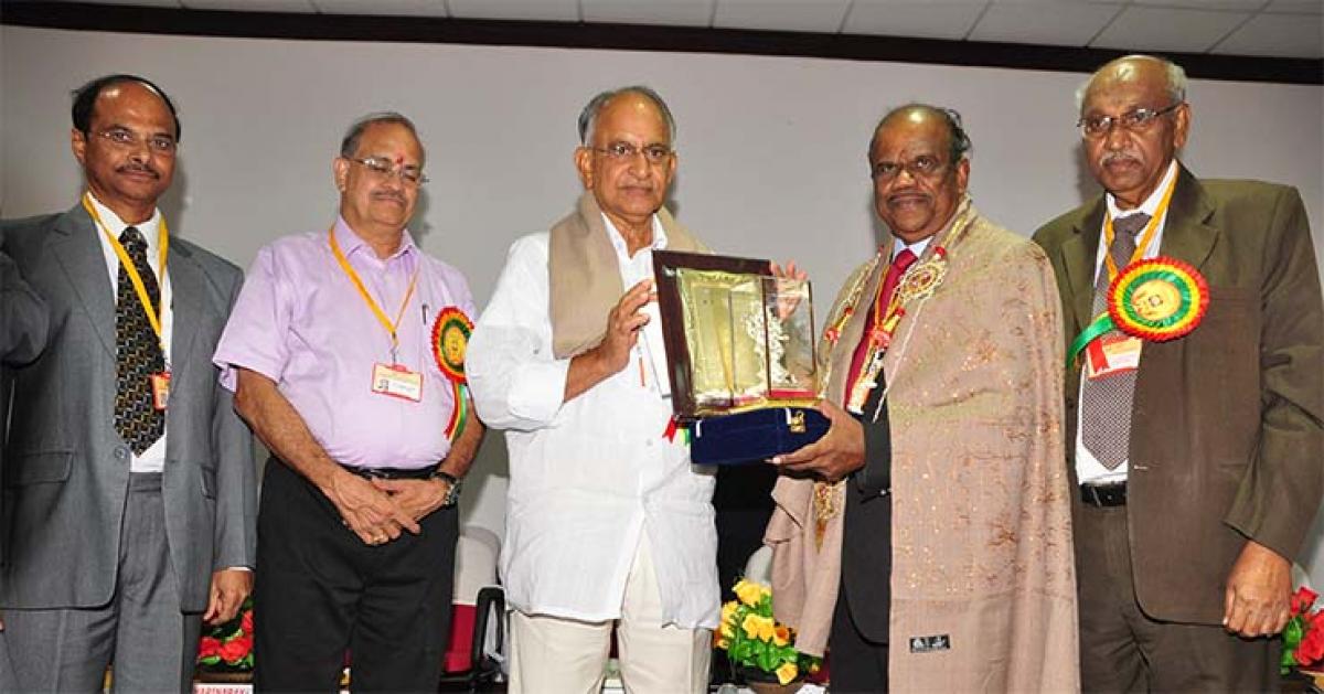 Gitam University president MVVS Murthi (centre) presenting Gitam Foundation Award to BrahMos Aerospace founder Dr Sivathanu Pillai at a function held on GITAM campus in Visakhapatnam on Saturday
